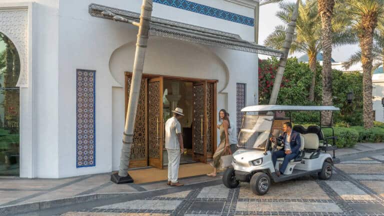 DXBPH-P0755-Hotel-Entrance-Woman-Walking-In-Daytime